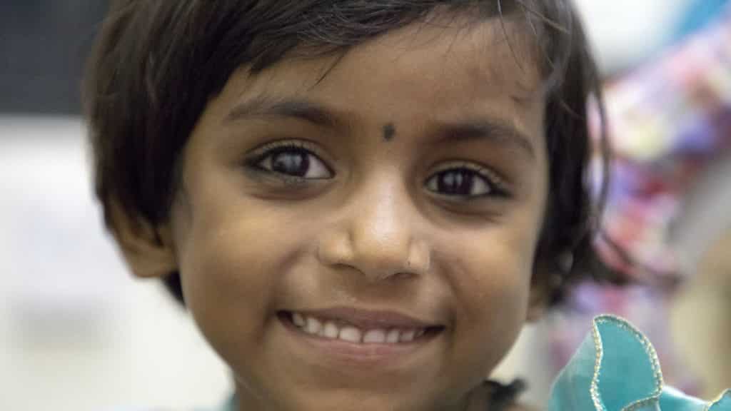 A girl with cataract smiling