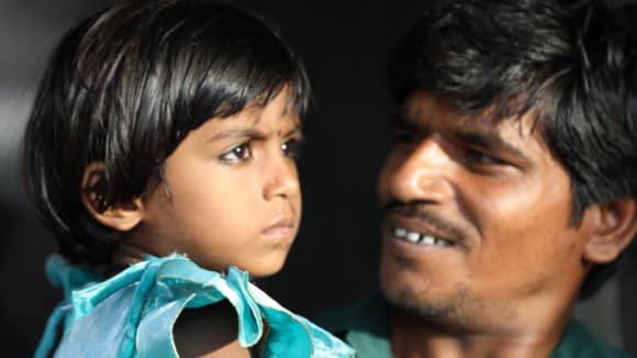 A young girl with her father.