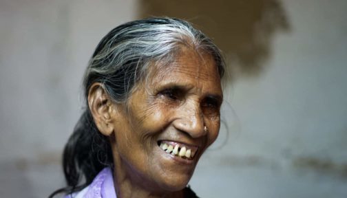 Closeup of a lady smiling.