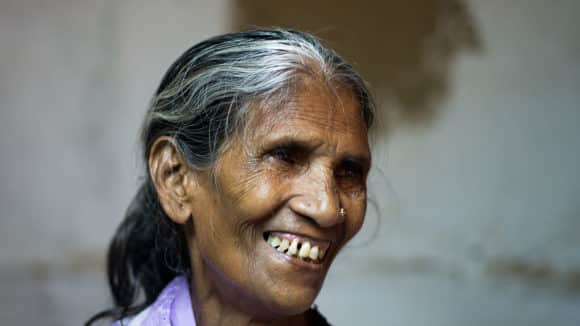 Closeup of a lady smiling.