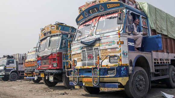 Colourful trucks parked next to each other.